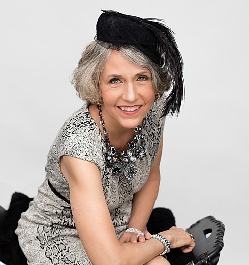 Woman over 70 with fascinator with a Smiling Silver Bob — church and Sunday hairstyle for women over 70