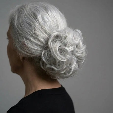 Woman over 70 with pinned Curls at the Nape — easy short-hair updo inspiration for women over 70