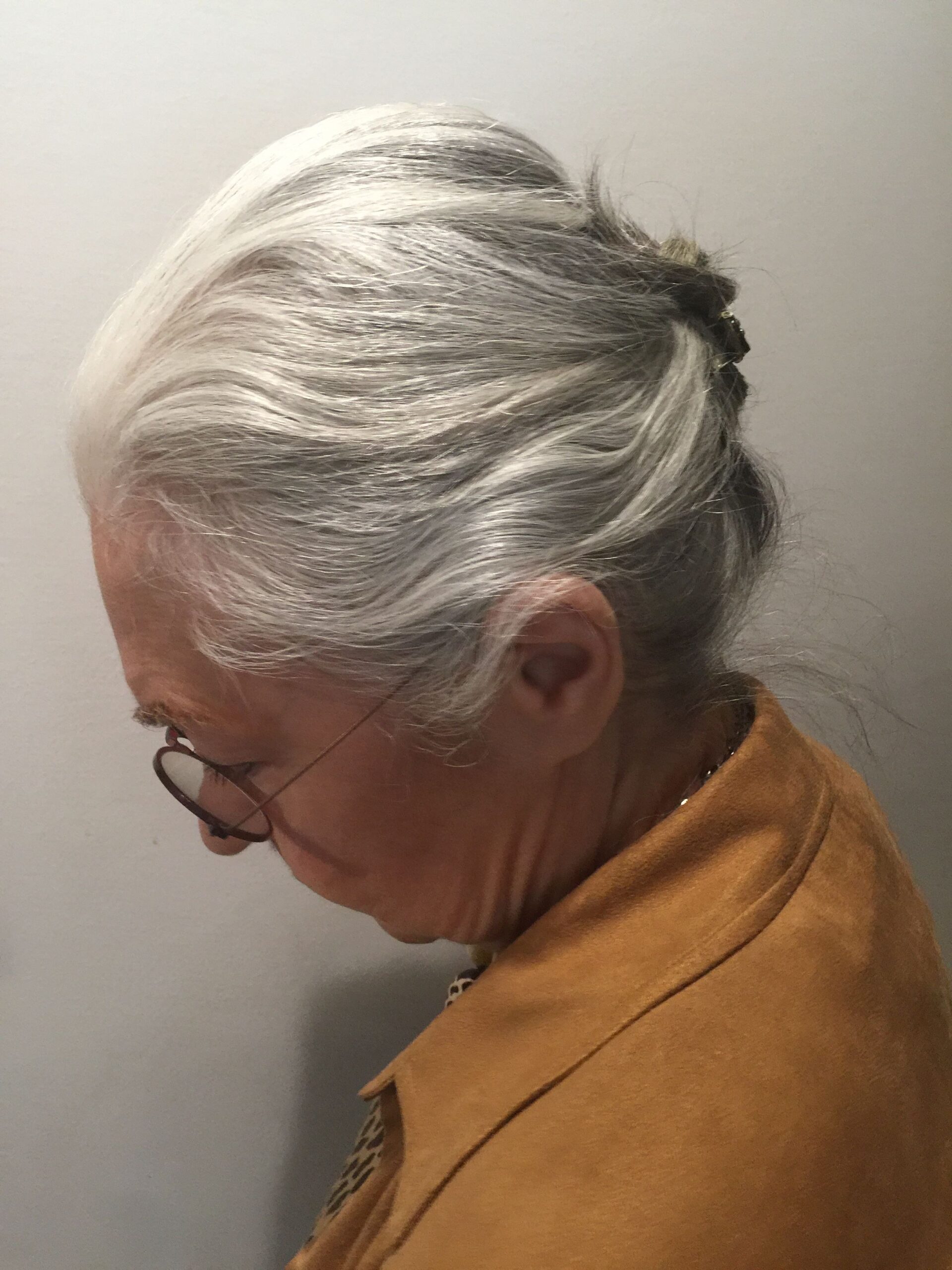 Woman over 70 with crossed-Pin Side Detail — easy short-hair updo inspiration for women over 70