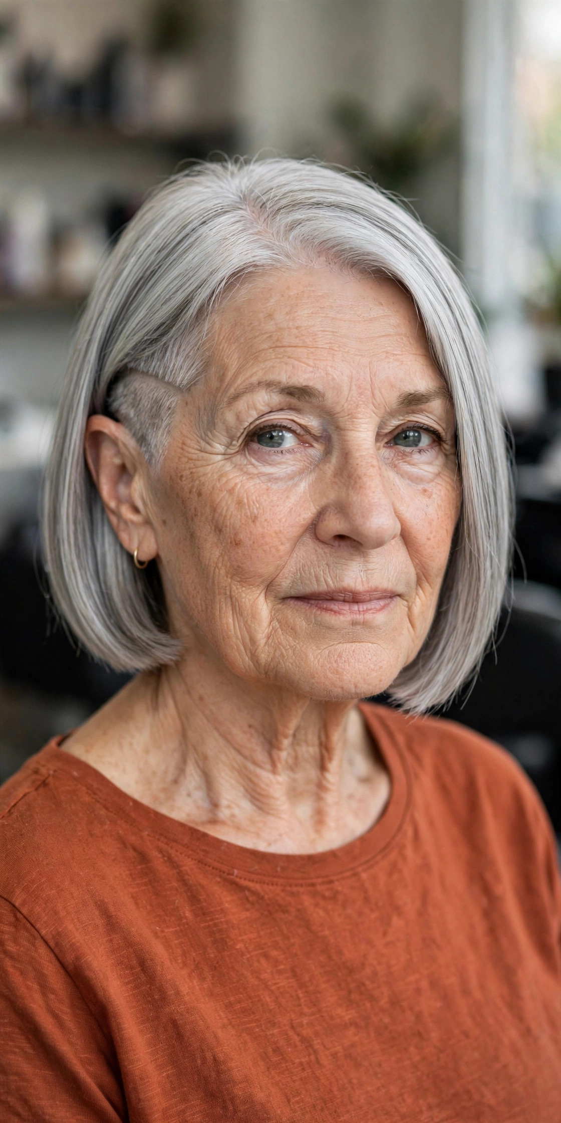 Undercut Bob With a Hidden Shaved Panel — edgy short haircut on a woman over 60