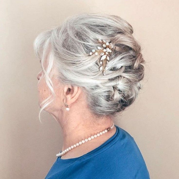 Woman over 70 with smooth Low Knot With Pearl Pins — elegant wedding hairstyle for grandmothers over 70 inspiration for women over 70