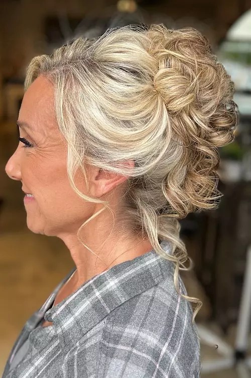 Woman over 70 with curly Pinned-Up Cluster — elegant wedding hairstyle for grandmothers over 70 inspiration for women over 70