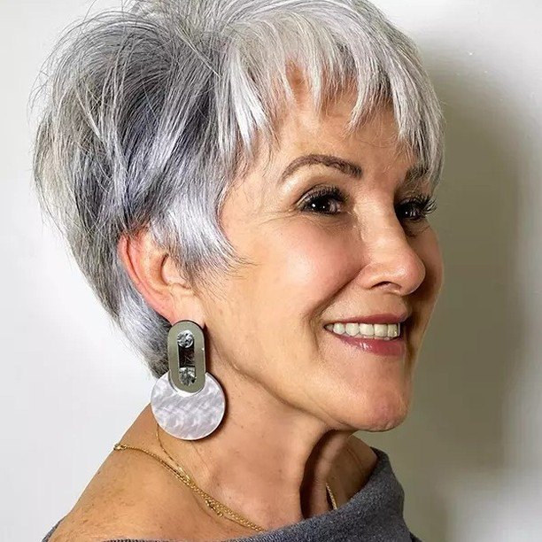 The Chic Swept Silver Pixie - gray hairstyle on a woman over 70