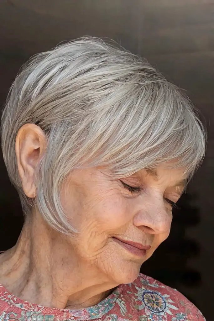 The Tucked-Behind-the-Ear Silver Bob - gray hairstyle on a woman over 70