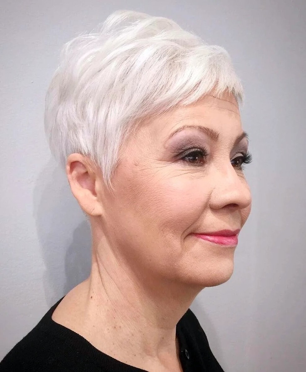 Woman over 70 with a bright white pixie — gray pixie hairstyle with soft texture for women over 70