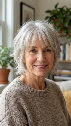 Gray shoulder length haircut on a woman over 70 with silver hair - Silver Shoulder Cut With Curtain Bangs