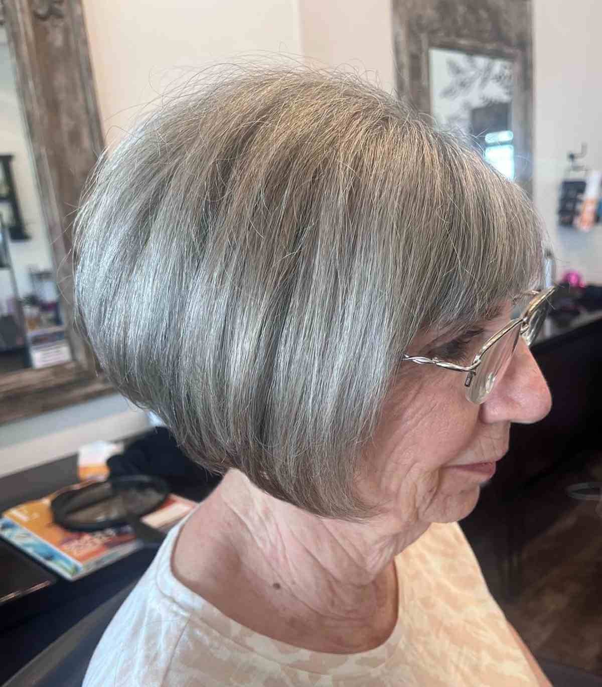 Gray shoulder length haircut on a woman over 70 with silver hair - Dove Gray Shoulder Cut With Rounded Layers