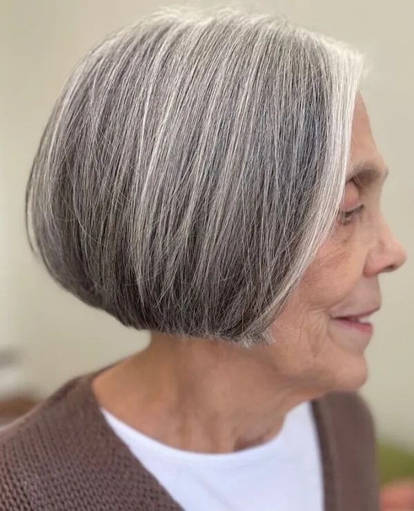 Gray shoulder length haircut on a woman over 70 with silver hair - Icy Silver Medium Cut With Movement