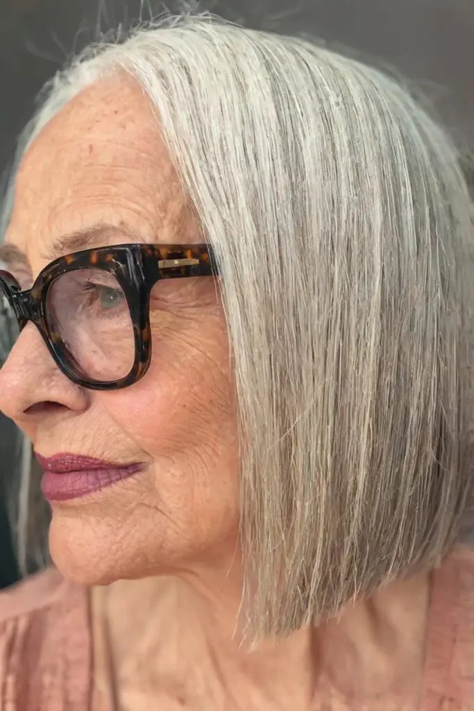 Gray shoulder length haircut on a woman over 70 with silver hair - Warm Gray Shoulder Cut With a Soft Bend