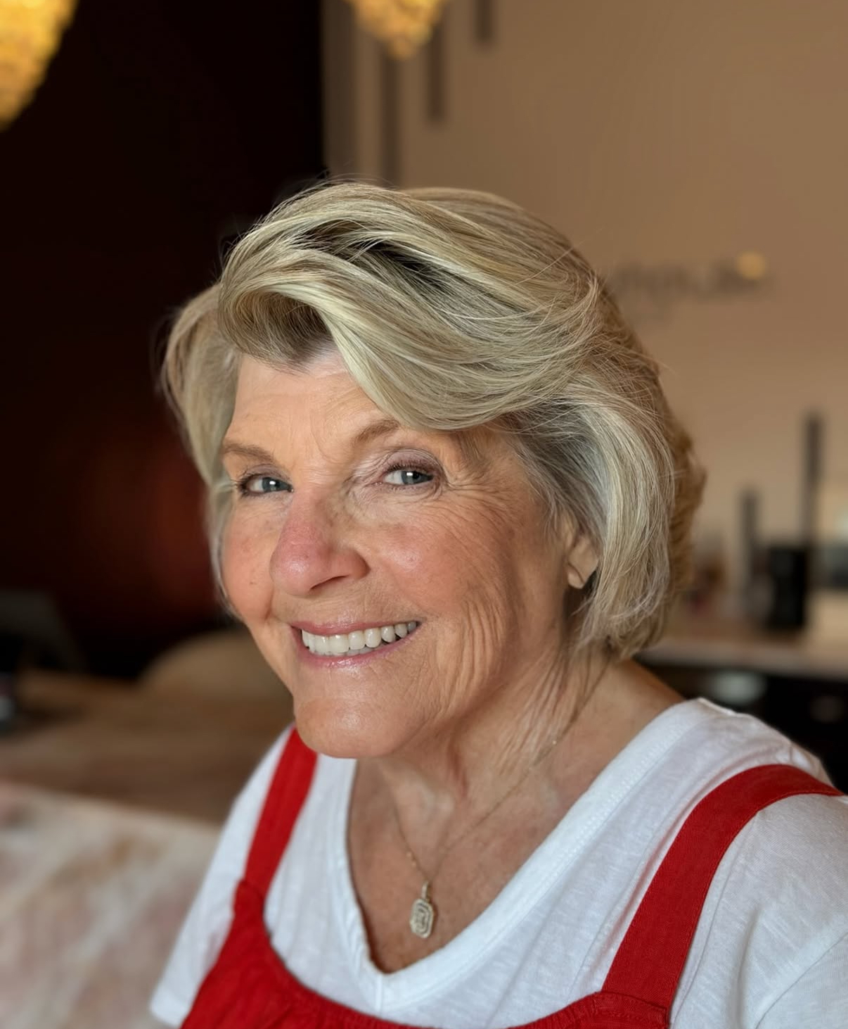 Keeping Colour: Ash Blonde Layers That Frame the Face — woman over 70 comparing going gray versus keeping hair color