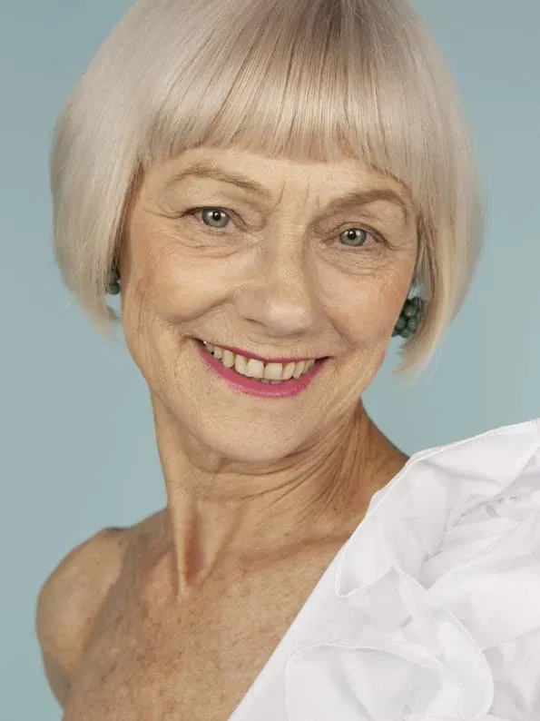 Going Gray: A Platinum Pageboy Worn With a Smile — woman over 70 comparing going gray versus keeping hair color
