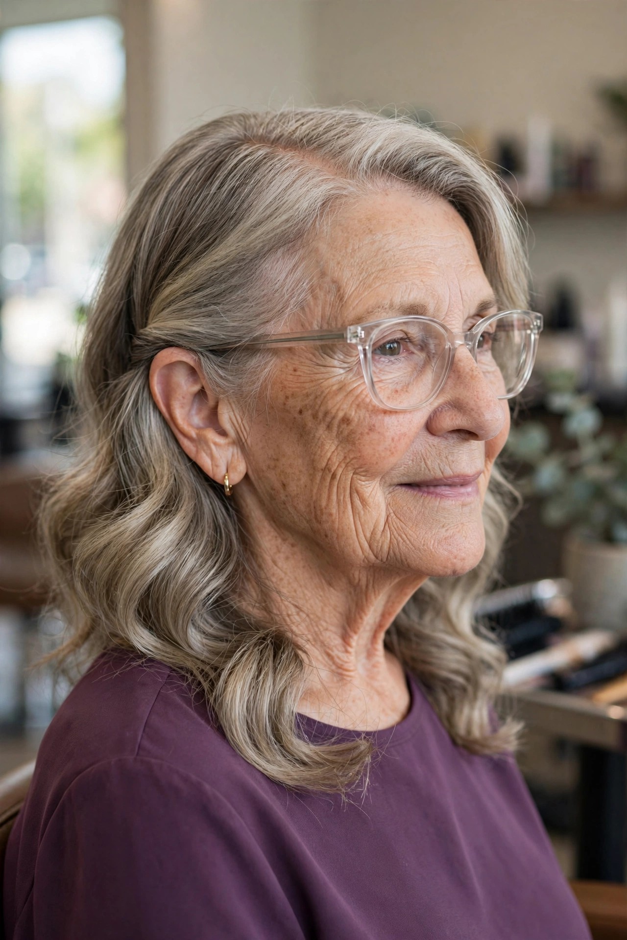 Wavy Lob with a Deep Side Part - hairstyle for a woman over 60 wearing glasses