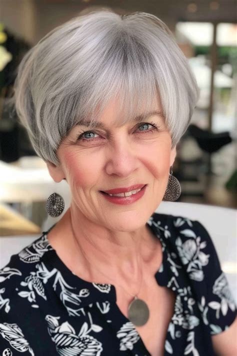 Woman over 70 with pixie-bob with a soft, face-framing fringe — flattering bangs hairstyle for women over 70