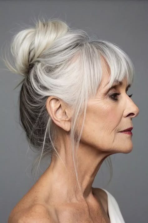 Woman over 70 with elegant updo with soft side bangs — flattering bangs hairstyle for women over 70