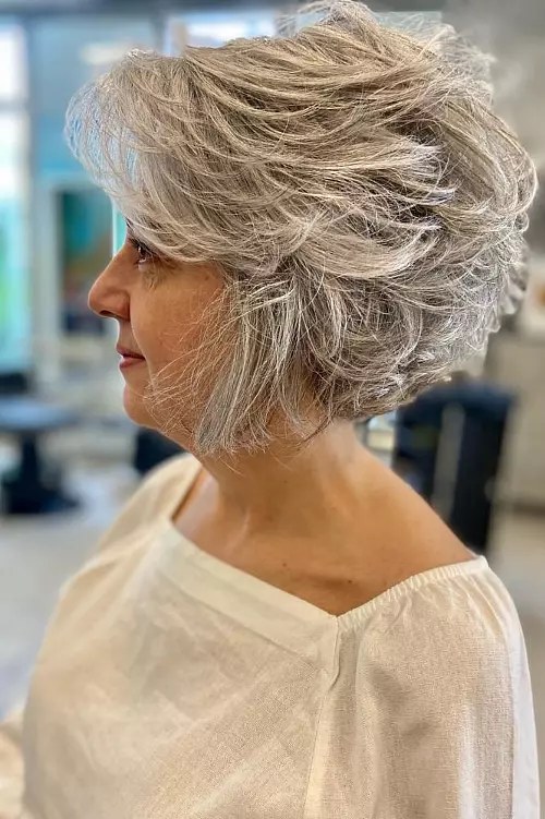 The Textured Wavy Bob, Side View — layered bob on thick wavy hair on a woman over 70