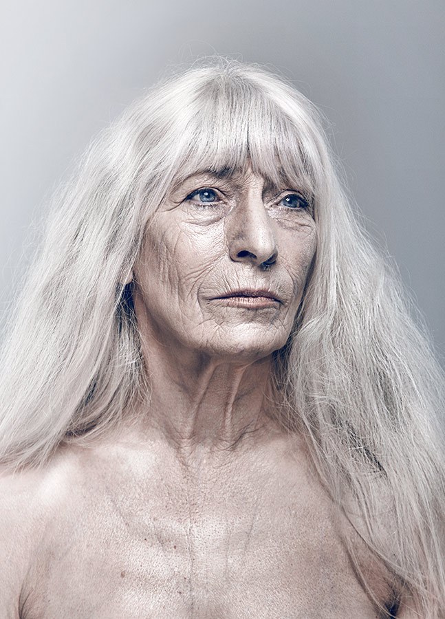 Woman over 70 with silver Hair With Soft Full Bangs — long gray hairstyle inspiration for women over 70
