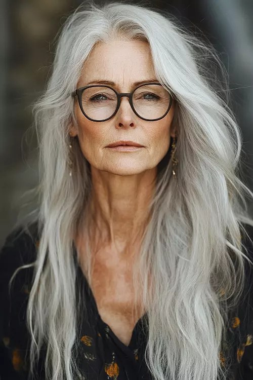 Woman over 70 with bright Silver Length With Glasses-Friendly Layers — long gray hairstyle inspiration for women over 70