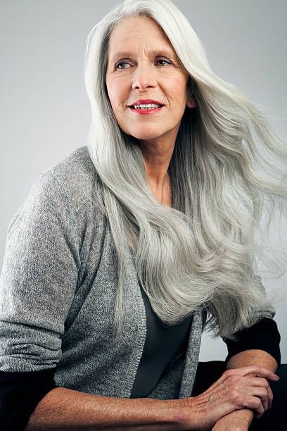 Woman over 70 with silver Waves to Mid-Back — long gray hairstyle inspiration for women over 70