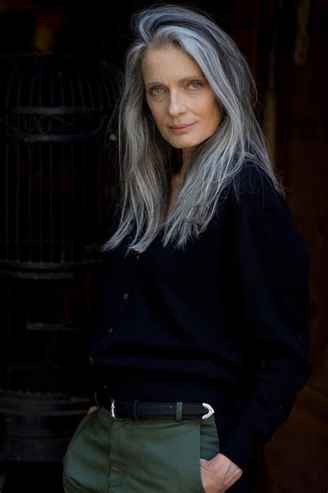 Woman over 70 with salt-and-Pepper Layers With a Side Part — long gray hairstyle inspiration for women over 70
