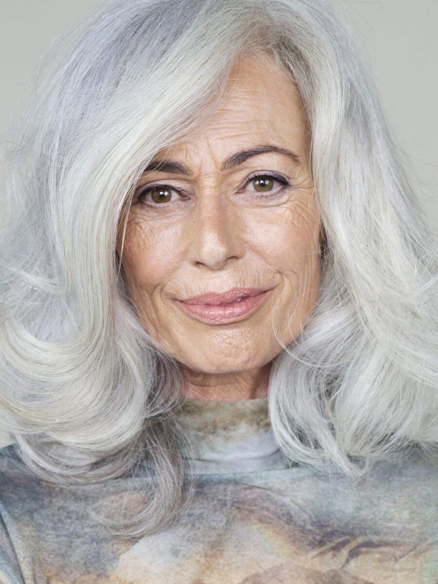 Woman over 70 with gray Layers With Bright White Face-Framing Pieces — long gray hairstyle inspiration for women over 70
