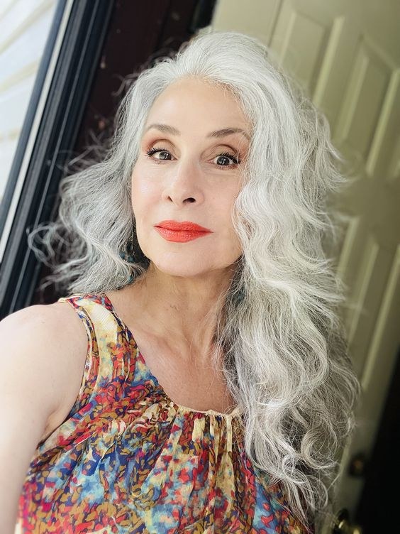Woman over 70 with long Hair in Loose, Brushed-Out Curls — long hairstyle inspiration for women over 70