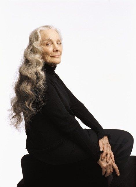 Woman over 70 with side-Swept Curls Over One Shoulder — long hairstyle inspiration for women over 70