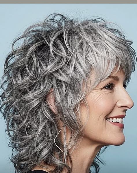 Silver Shag Curls With Graphite Depth — lowlights for gray hair on a woman over 70 adding depth while hair stays mostly silver