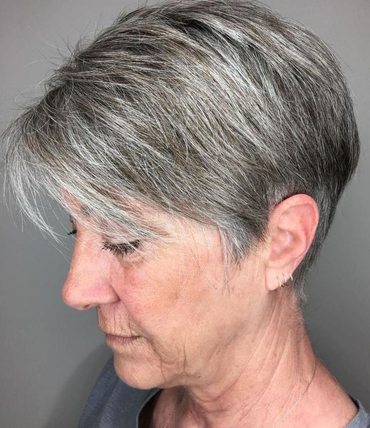 Salt-and-Pepper Pixie With Silver Streaks — lowlights for gray hair on a woman over 70 adding depth while hair stays mostly silver