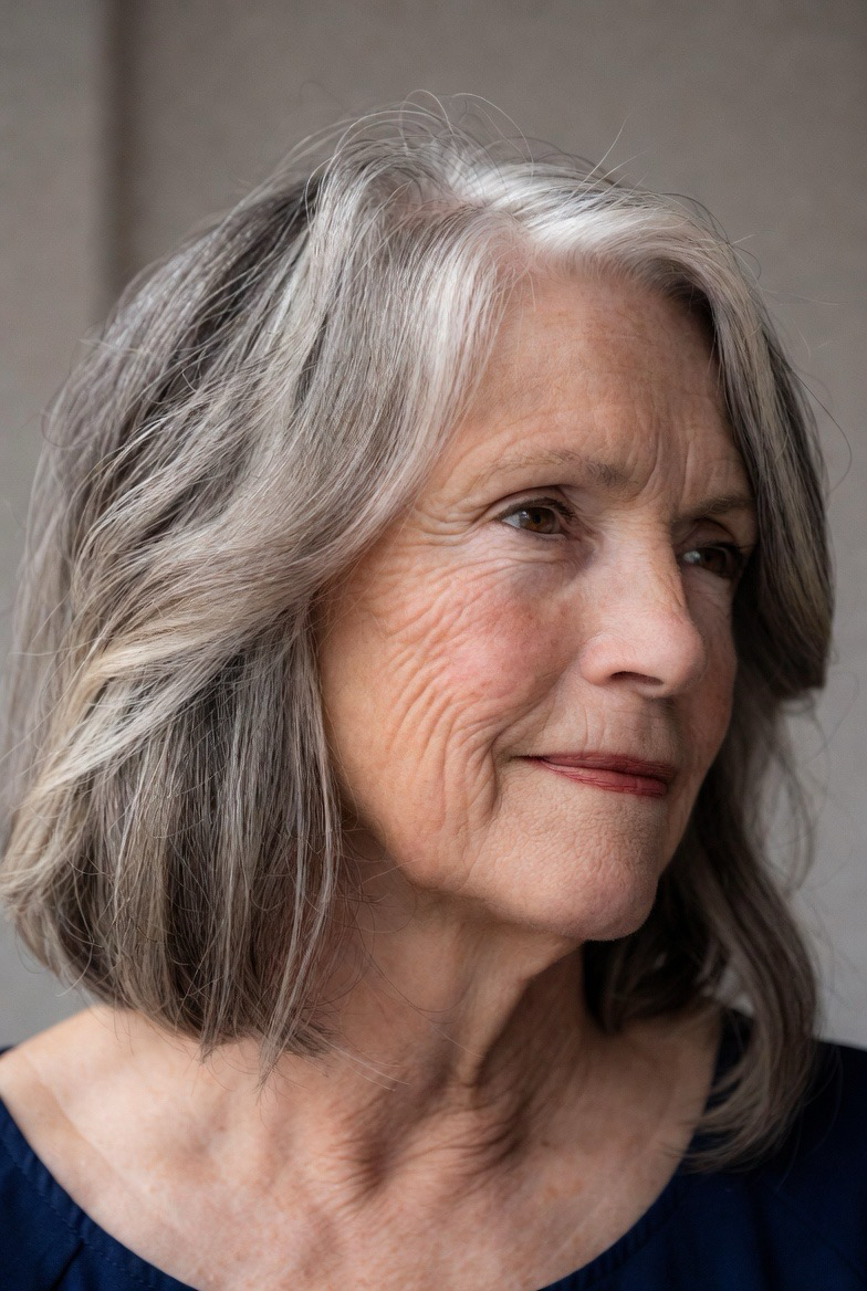 Gray-Brown Bob With Face-Brightening Silver — lowlights for gray hair on a woman over 70 adding depth while hair stays mostly silver