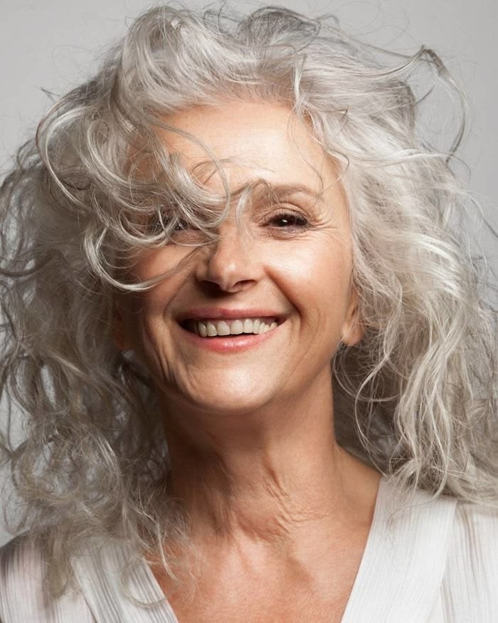 Medium layered haircut for thick hair on a woman over 70 with full dense hair - Heavy Hair Tamed With Long Layers