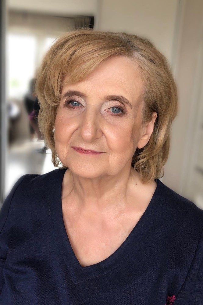Medium length hairstyle on a woman over 70 with graceful layers - Wavy Lob With a Deep Side Part