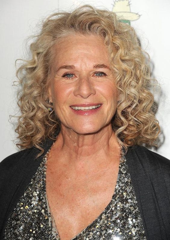 Medium length hairstyle on a woman over 70 with graceful layers - Smooth Medium Cut With a Soft Bend