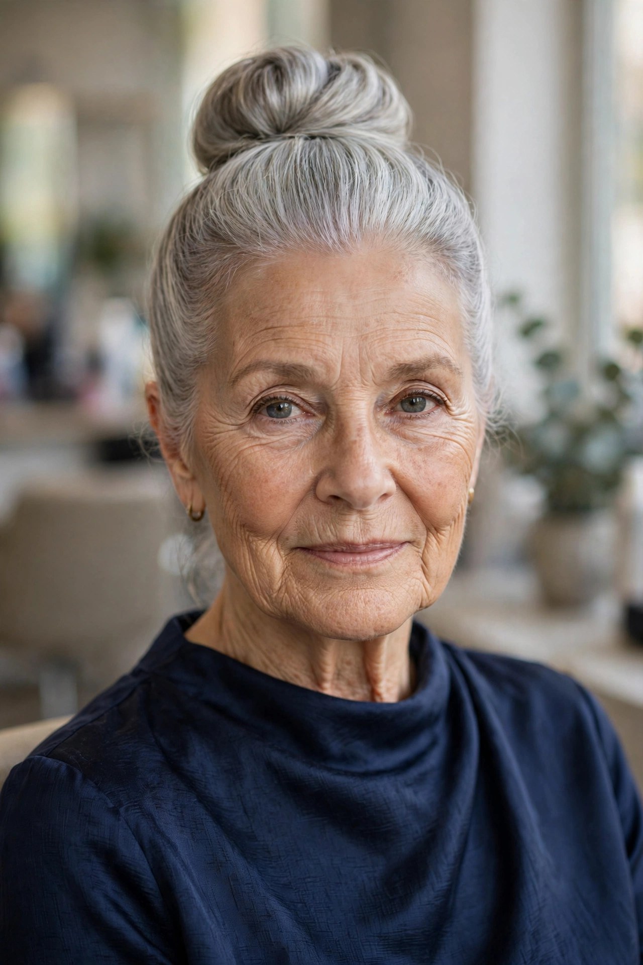 Sleek High Bun with Crown Volume - mother of the bride hairstyle for a woman over 60