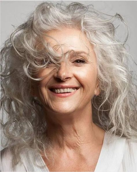 Wild and Free Long Silver Curls — curly hairstyle on a woman over 70 with natural texture