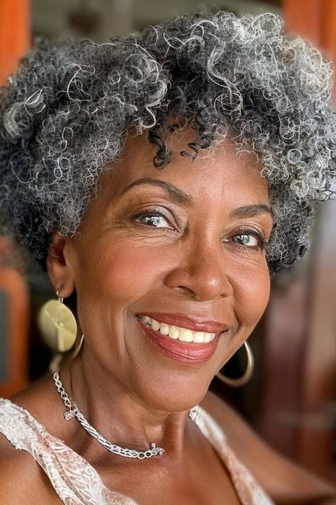 Gray Curls and Gold Hoops — natural hairstyle on a Black woman over 70