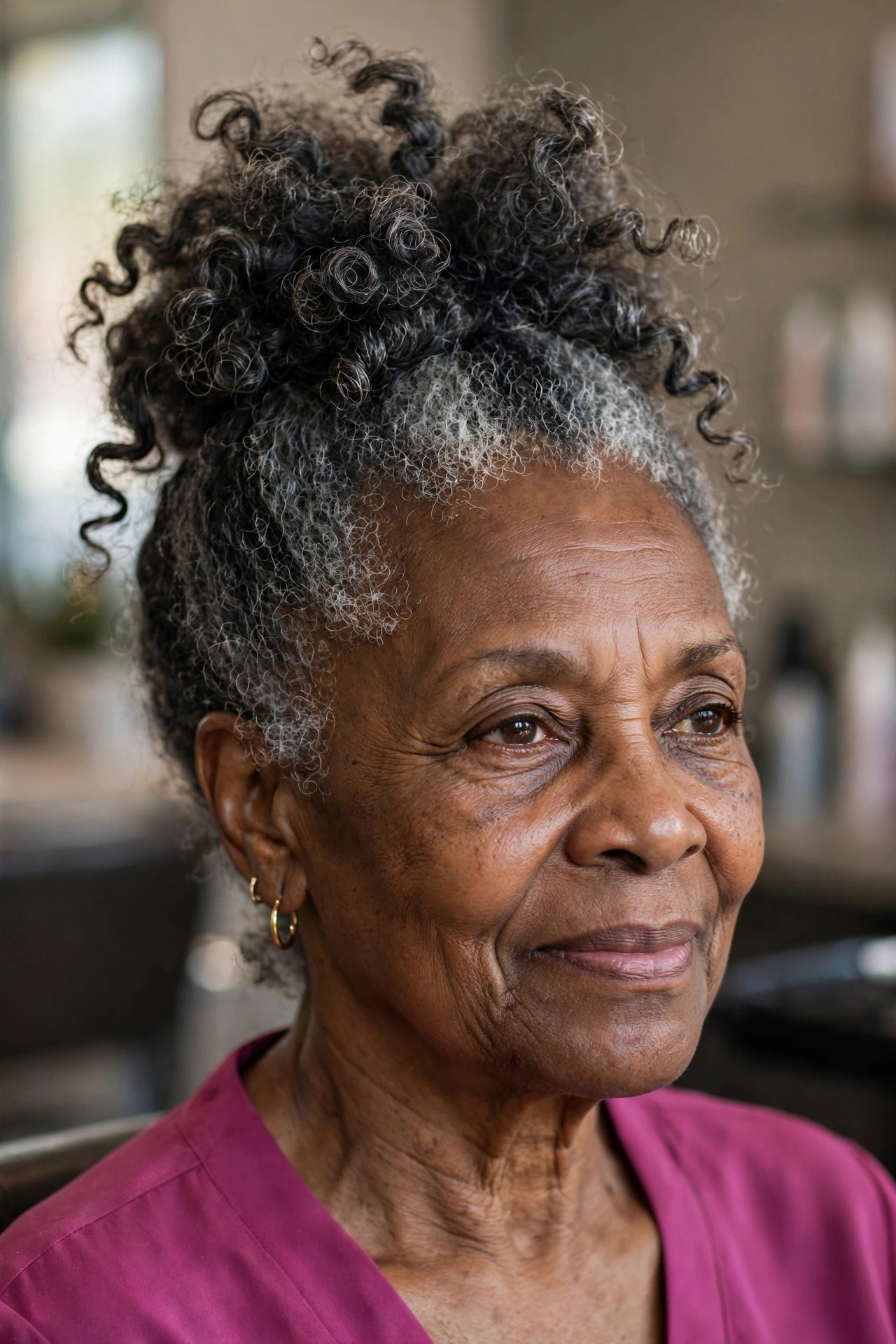 Salt-and-Pepper Pineapple Updo - natural hairstyle on a Black woman over 60 with gray hair