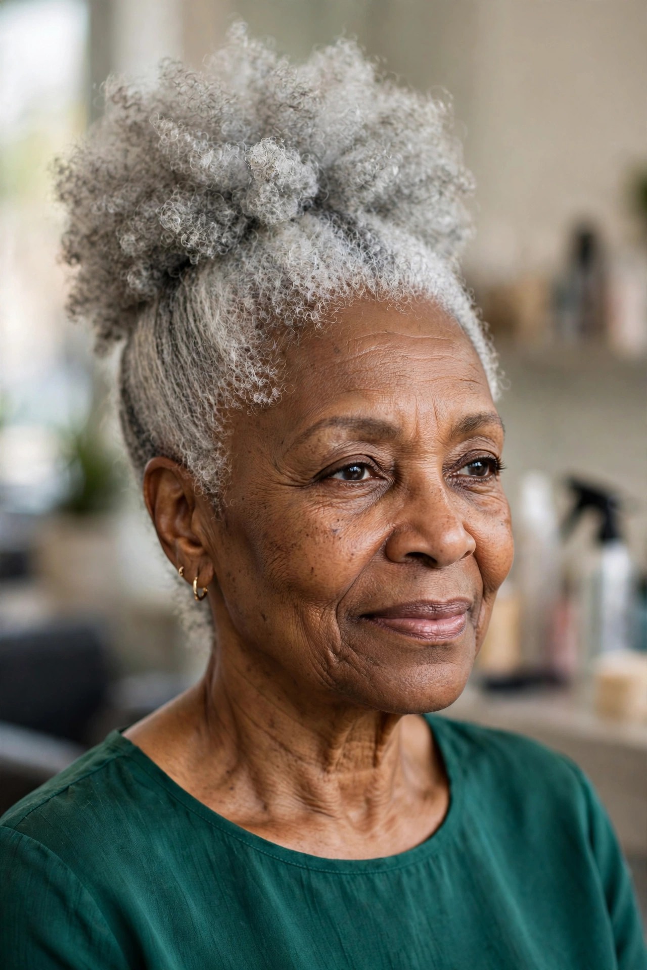 Silver Afro Puff - natural hairstyle on a Black woman over 60 with gray hair