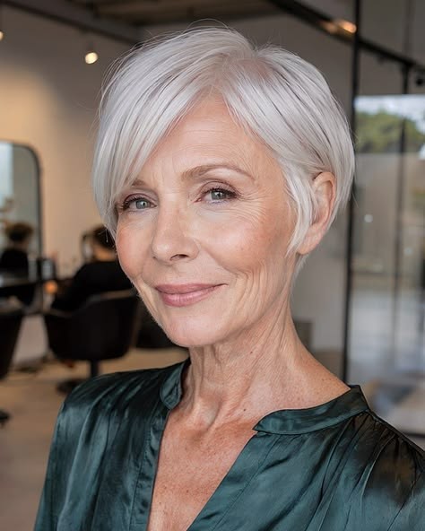 Woman over 70 with a sleek side-parted pixie — effortless pixie haircut idea for women over 70