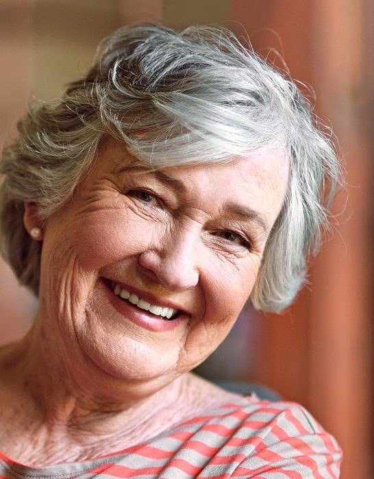 The Laughing Wavy Bob With Face-Framing Pieces — round face hairstyle on a woman over 70