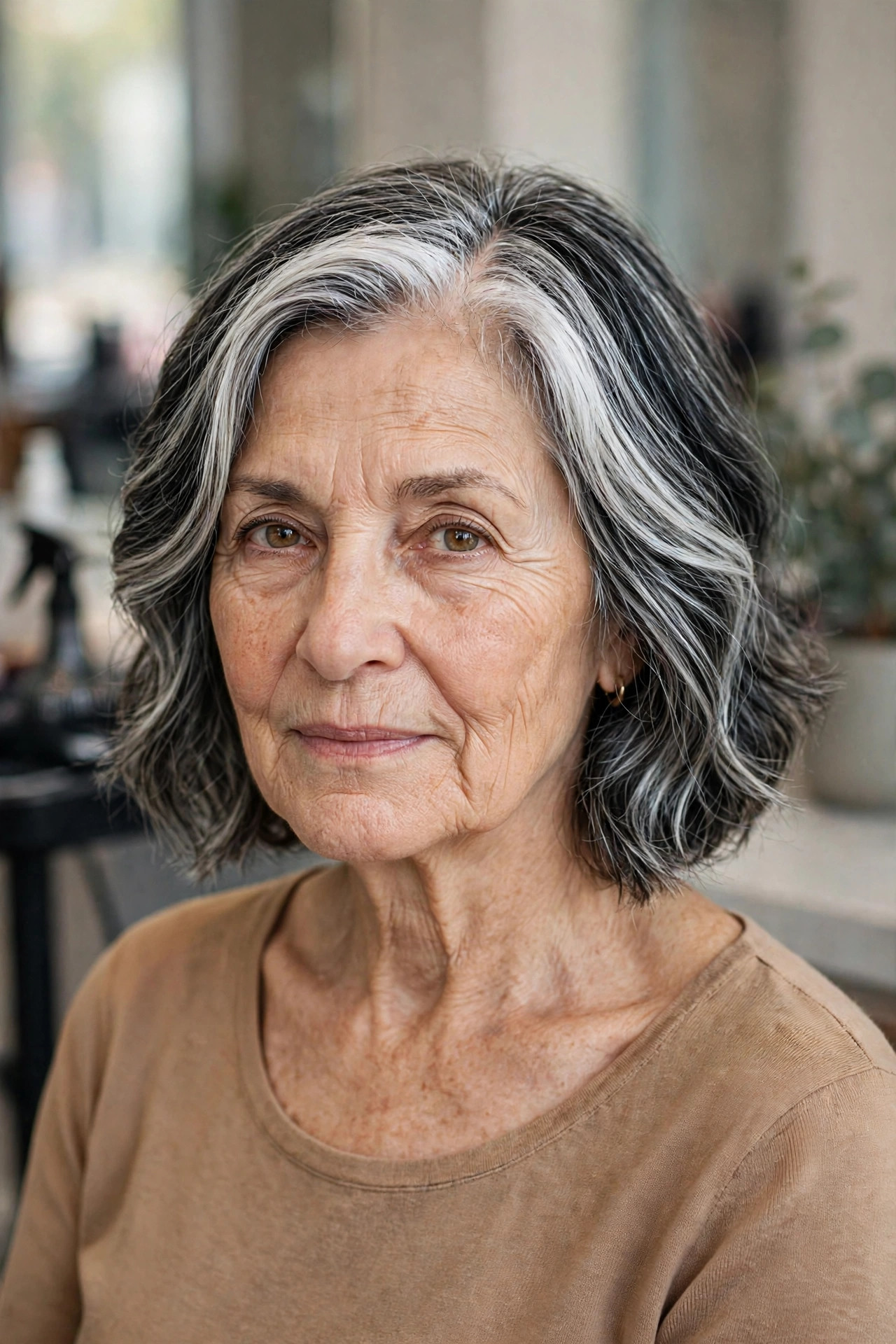 Deep Side Part with Soft Waves - salt and pepper hairstyle for a woman over 60