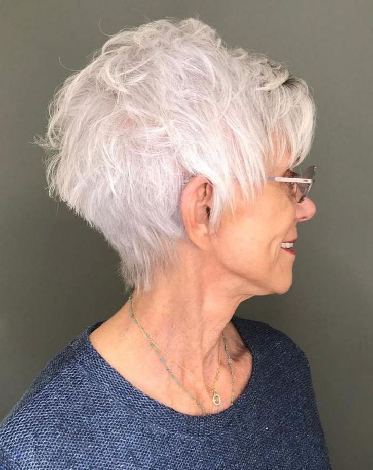 Curly White Crop That Sits Cleanly With Glasses — short hairstyle for coarse gray hair on a woman over 70