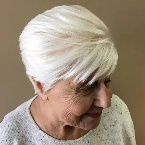 The Side-Swept White Crop With a Soft Fringe — short hairstyle for coarse gray hair on a woman over 70