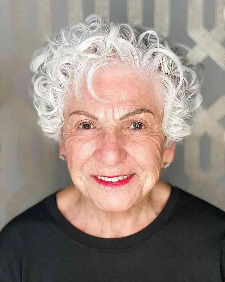 Cheerful White Curls, Front and Center — short curly haircut on a woman over 70, easy to care for
