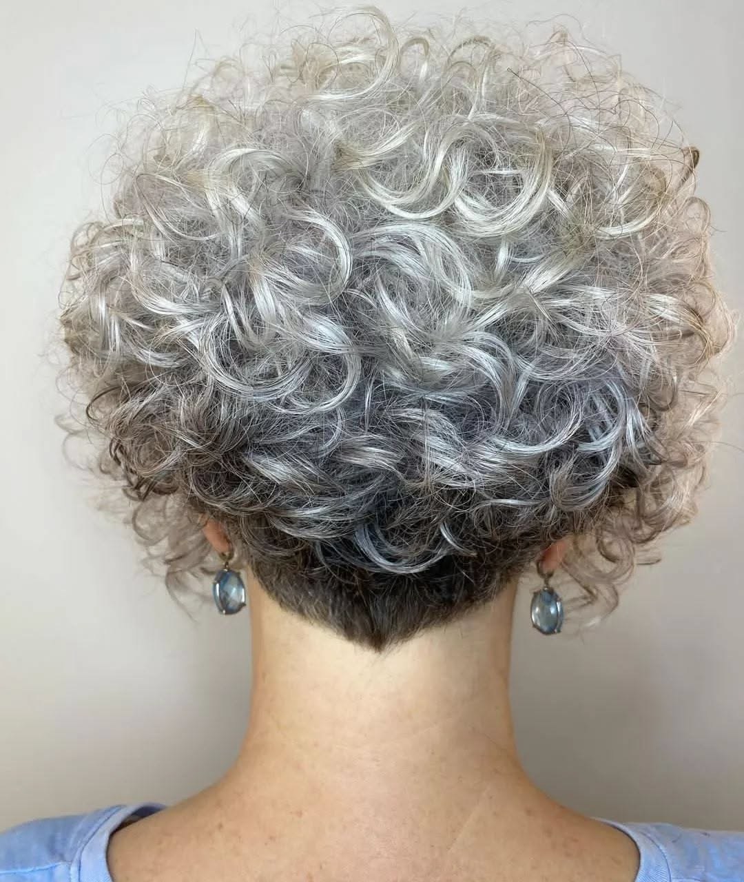 The Curly Bob With a Tidy Undercut, Back View — short curly haircut on a woman over 70, easy to care for