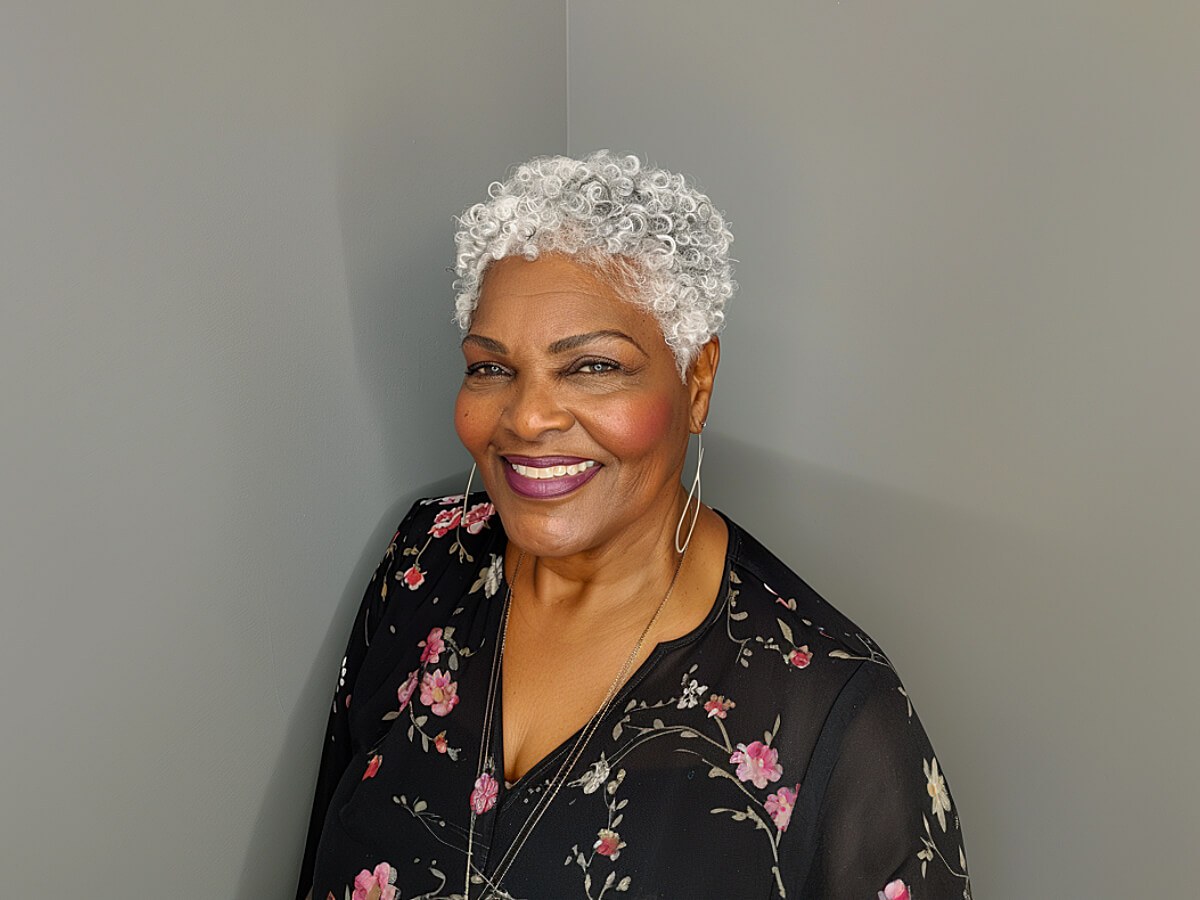 The White Curly Crop and a Big Smile — short gray natural haircut on a Black woman over 70