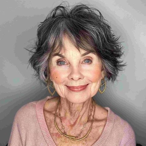 The Dark Layered Shag With Silver Threads — short haircut on a woman over 70 with a soft jawline