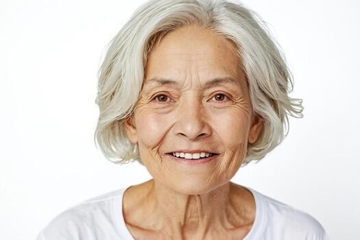 Woman over 70 with a gentle wavy white bob — short hairstyle for women over 70