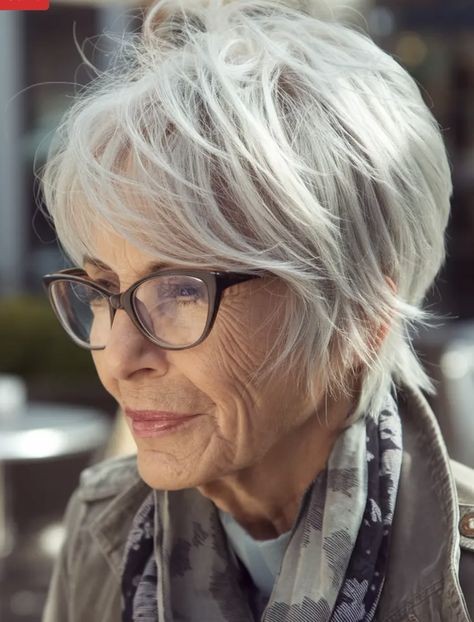 Woman over 70 with a tousled pixie styled with glasses — short hairstyle for women over 70