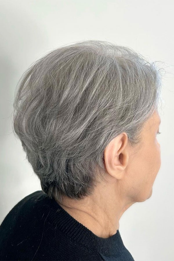 Woman over 70 with a natural gray crop — profile and back — short layered haircut back view for women over 70