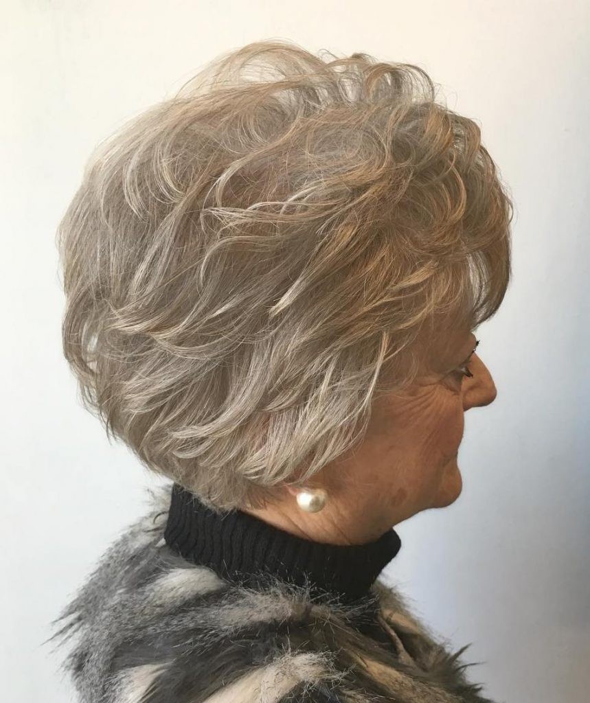 Woman over 70 with a curly layered bob — profile and back — short layered haircut back view for women over 70